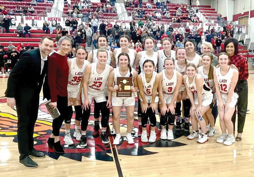 Purcell’s Dragons hiked their season record to 15-8 and won the District Championship Friday night with a 54-47 victory over CHA. Purcell will play at Meeker in the Regional Tournament. See story on page 2B.