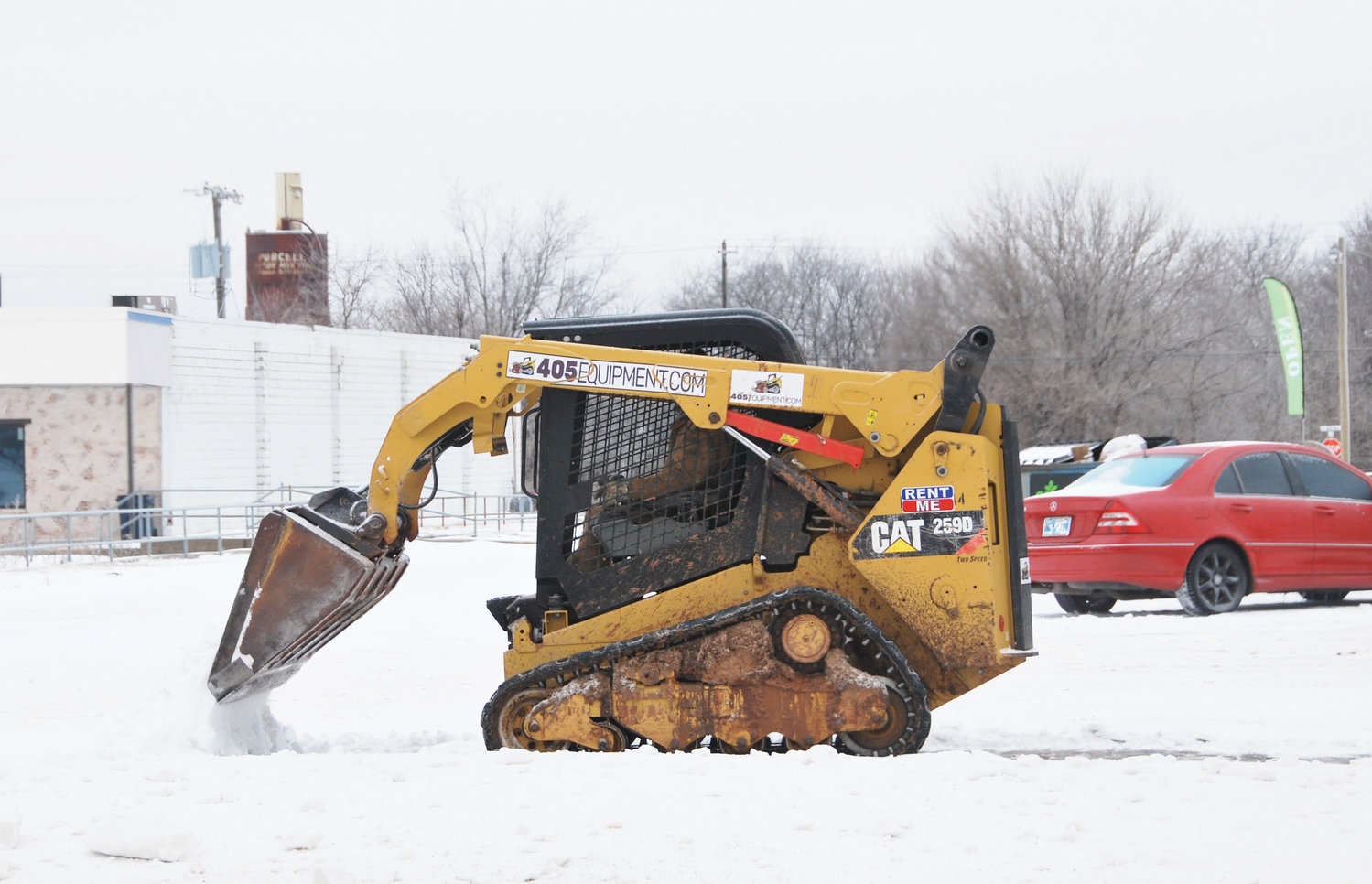 Bobcats were handy equipment last week to clear away ice in parking lots after the two-day, two-wave ice and sleet storm that paralyzed the area canceling schools and other events.
