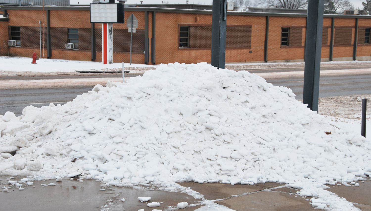 After the concrete was cleared off at Criswell’s Texaco the remains made a giant pile of ice that will be around for awhile.