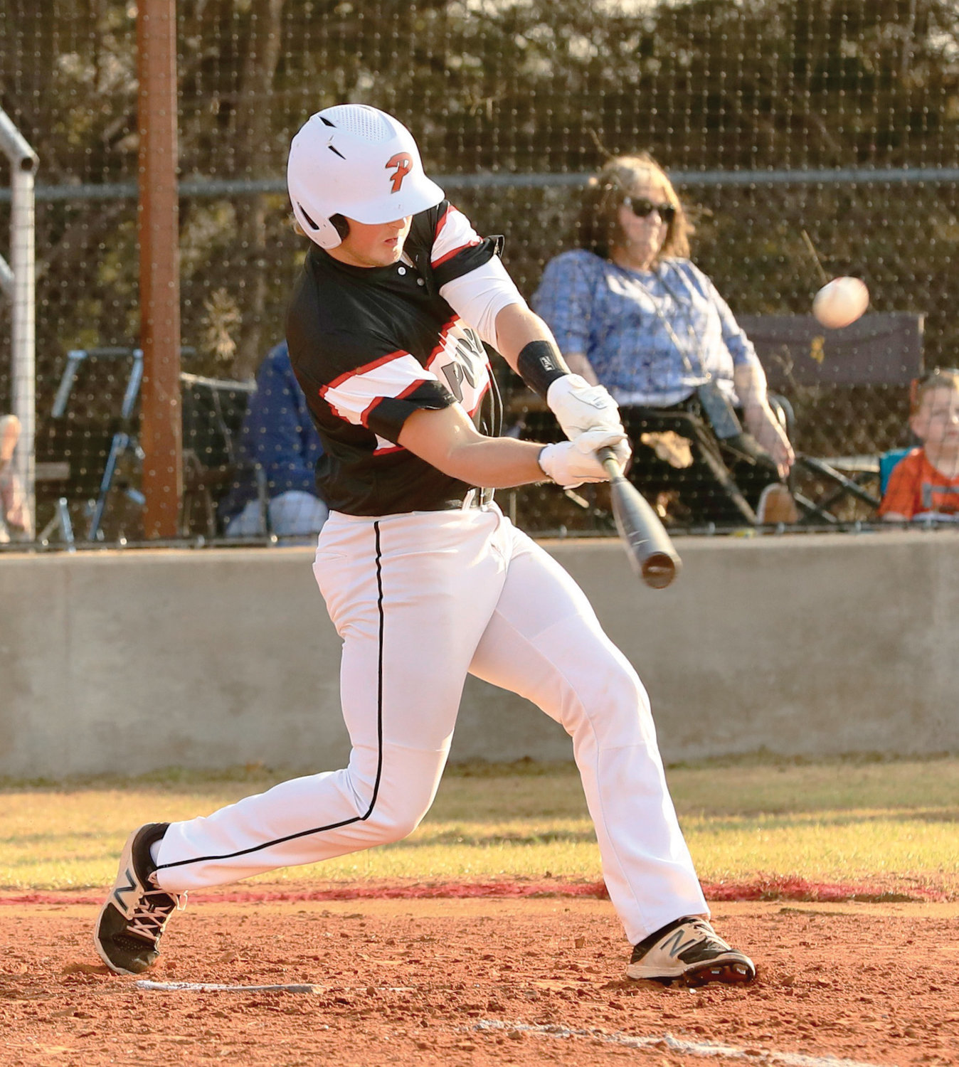 Purcell senior Creed Smith smacks a home run in the first inning against Noble Friday. The Dragons lost 9-1.