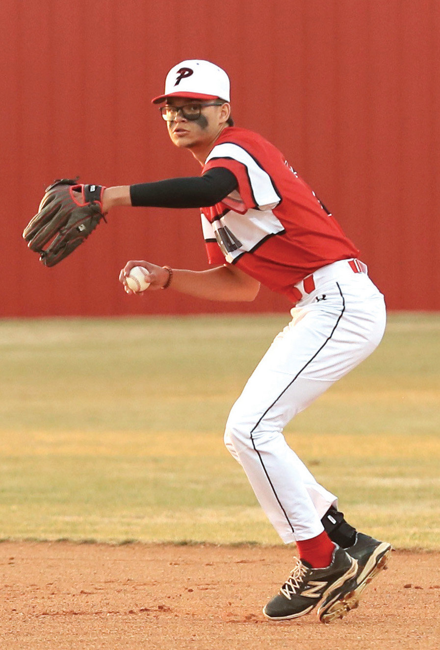 Purcell senior Quentin Goforth fields a ball and comes up throwing to first base for an out against Wayne during the Dragons’ 8-0 win over the Bulldogs. Story on page 9B.
