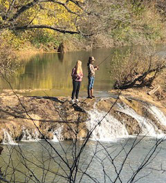 Abby Sample and Dax Beason comprise one of two competition fishing teams at Lexington Public Schools. They were among 24 Lexington students who tried their angling skills during a trout fishing field trip to Blue River. James Clevenger, outdoor education teacher for the district, said the district’s second fishing team is Wyatt Woods and Wyatt McBride.