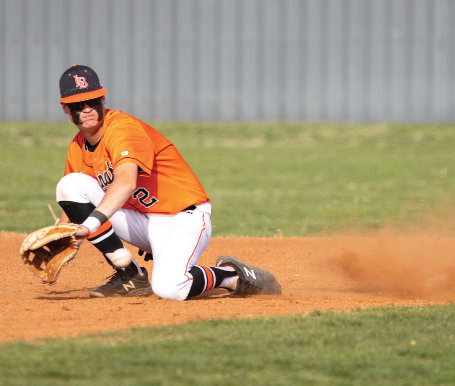 Lexington sophomore Drew Dierking stops the ball at second base during the Bulldogs’ game against Heritage Hall. Lexington fell 17-5. The Dawgs played Keifer Wednesday in the Bi-District tournament.