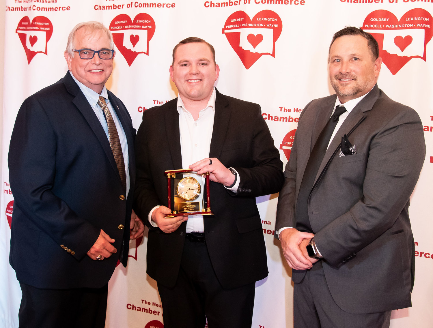Landmark Church, represented by Ethan Sellers, was honored at the chamber banquet as the Spirit Guardian Award winner. City Manager Dale Bunn and Chamber President Chris Goldsby made the presentation. The Spirit Guardian Award is given annually to a person or organization who demonstrates distinguished human services.