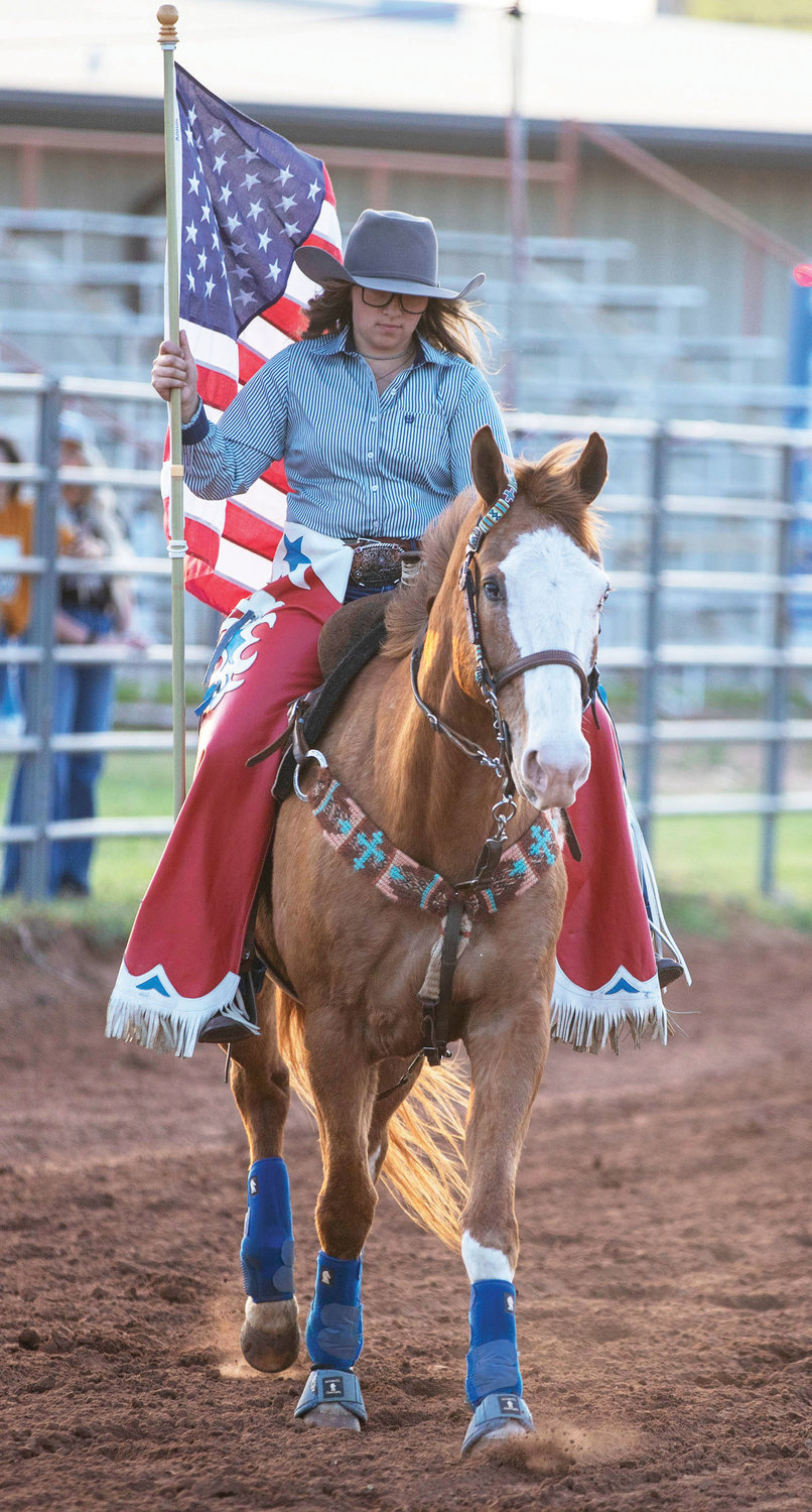 Kelsey Padilla rides with Old Glory at the Purcell Pro Rodeo PRCA event at the McClain County Expo on Friday.