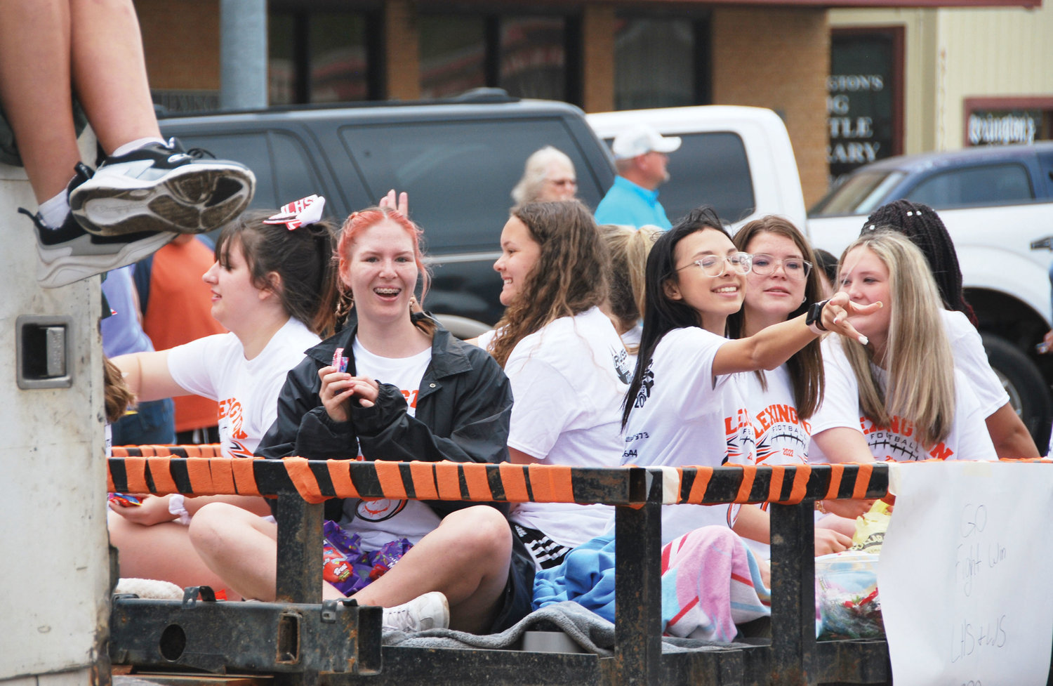 Lexington students let the candy fly out of their float entry in the annual 89er’s Day Parade.