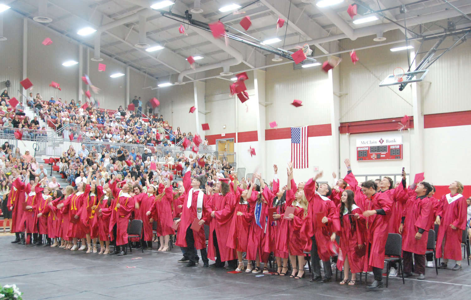 The Class of 2022 at Purcell High School celebrate the occasion of their graduation from high school with the tossing of their caps at the conclusion of the event last Friday at The Reimer Center.