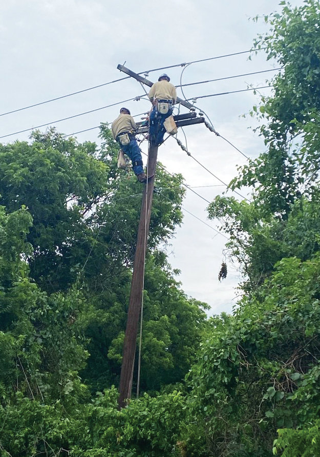 Electric department heroes Dillon Gardner and Anthony Lamirand were forced to climb the pole the old-fashioned way to restore power to Purcell last Friday. The affected pole was between Walnut Creek and I-35 with no way to get a bucket truck close enough to work on the line. Once they came down power was restored after a 4.35 hour outage.