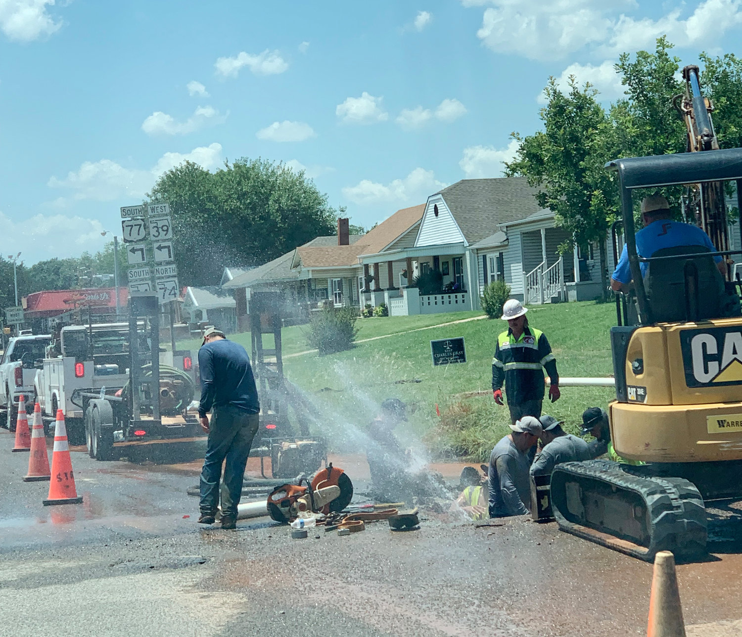 A Purcell crew works to repair a water main break at the corner of Washington and 4th streets Thursday. City Manager Dale  Bunn said heat is moving deeper into the ground expanding an old steel line. The same problem exists moving west on Washington.