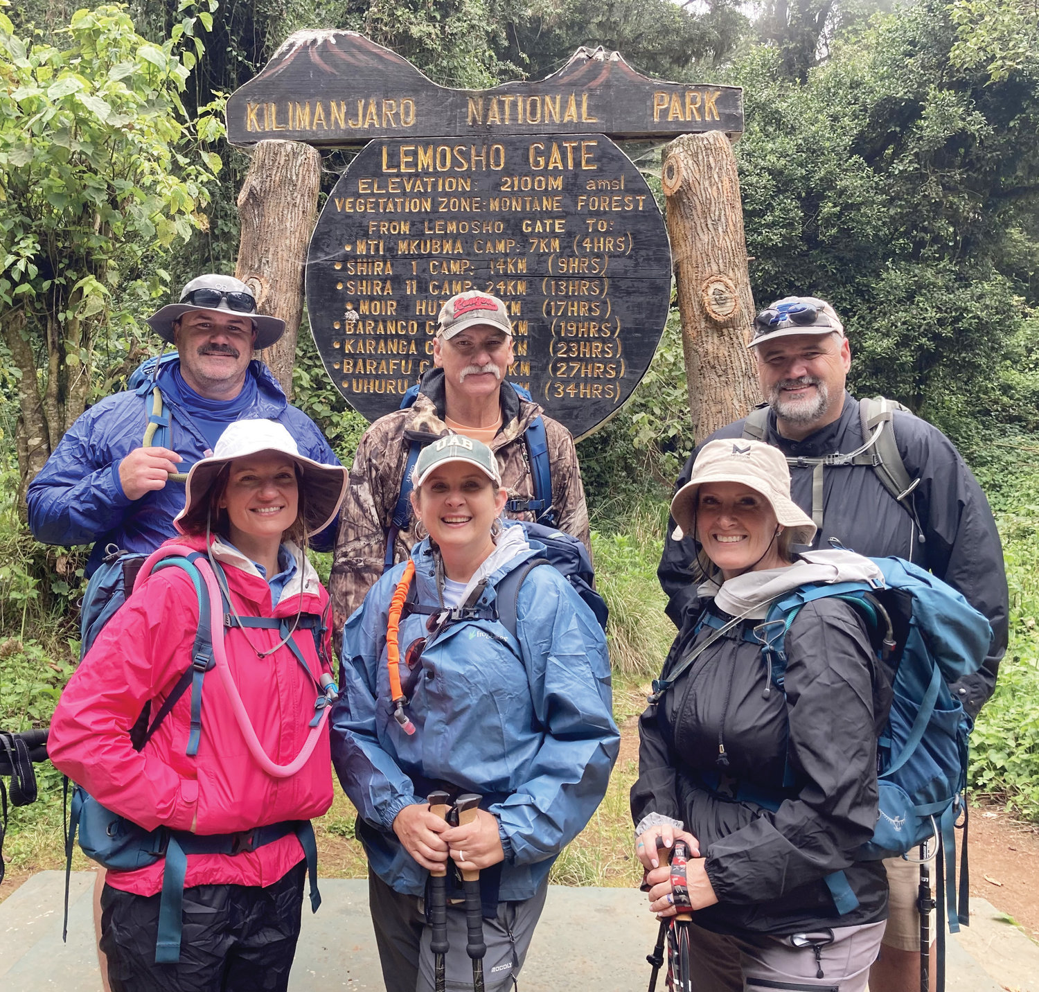 On their way in Kilimanjaro National Park, from left, back row, Justin Carr, Vince Fulks and Ted Cox. On the front row are Nicolle Carr, Kimberly Fulks and Lori Cox.