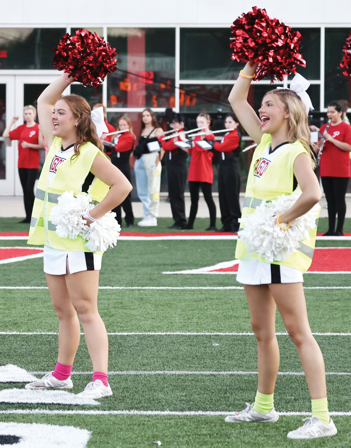 Senior Purcell cheerleaders Avery Wren and Annistyn Raper lead cheers in the spirit line before Purcell’s game against Pauls Valley Friday.