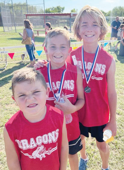 Chance Midkiff, right, was sixth and Hayes Anderson (middle) was 12th in a recent cross country competition at Middleberg. Trigg Anderson, left, provided moral support.