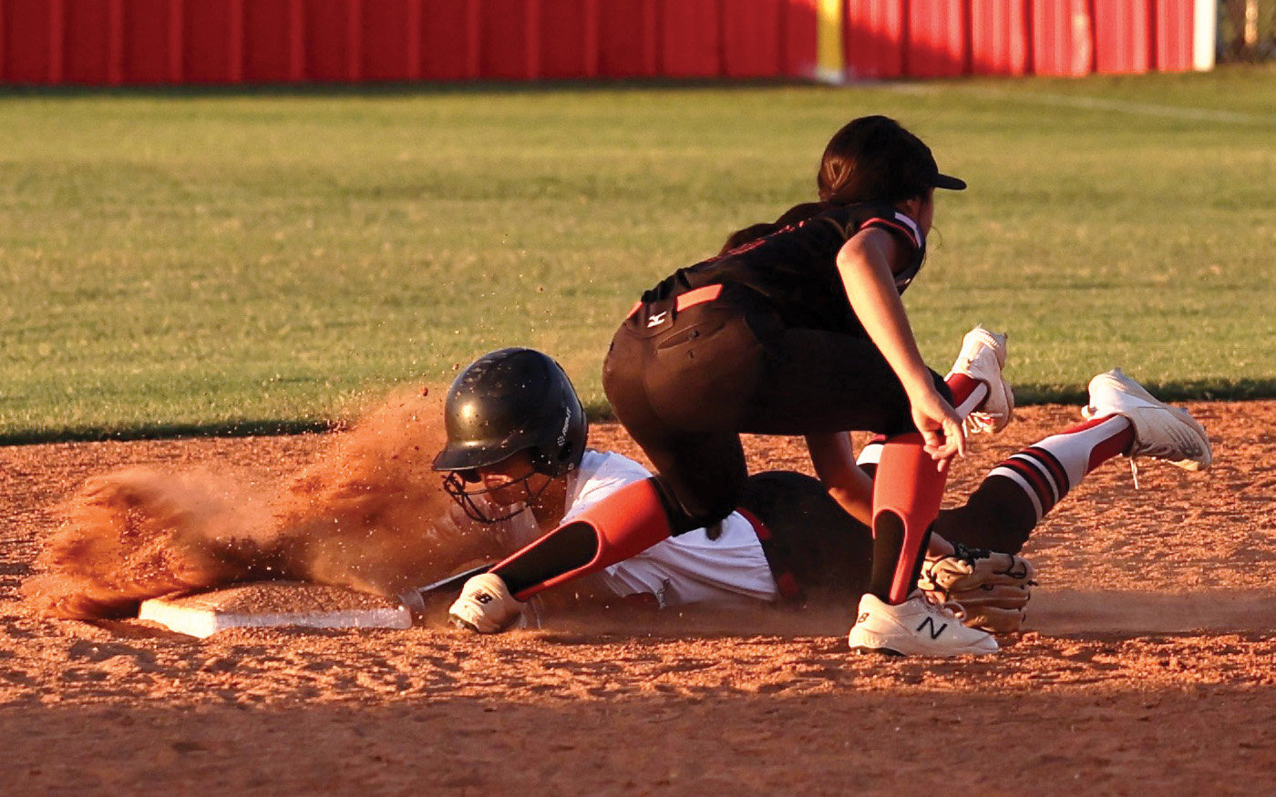 Purcell senior KK Eck beats the tag to safely slide into second base against Lexington. The Dragons fell 8-6 to the Bulldogs.
