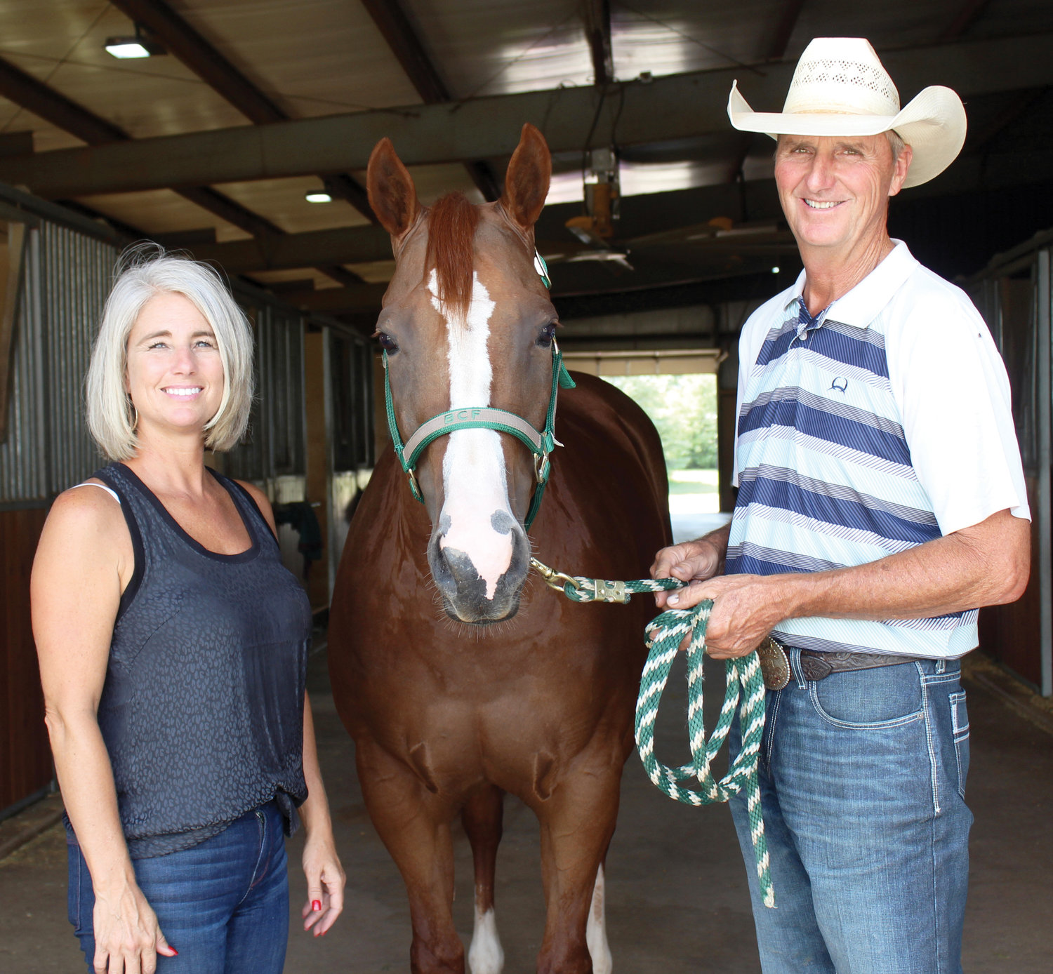 Becky and Gil Galyean are pictured with Knockin’ It Out, one of the western pleasure stars in their show barn southeast of Purcell. The Galyeans train and show the 6-year-old mare for owners Richard and Betty Jo Carr of Bremen, Ind.