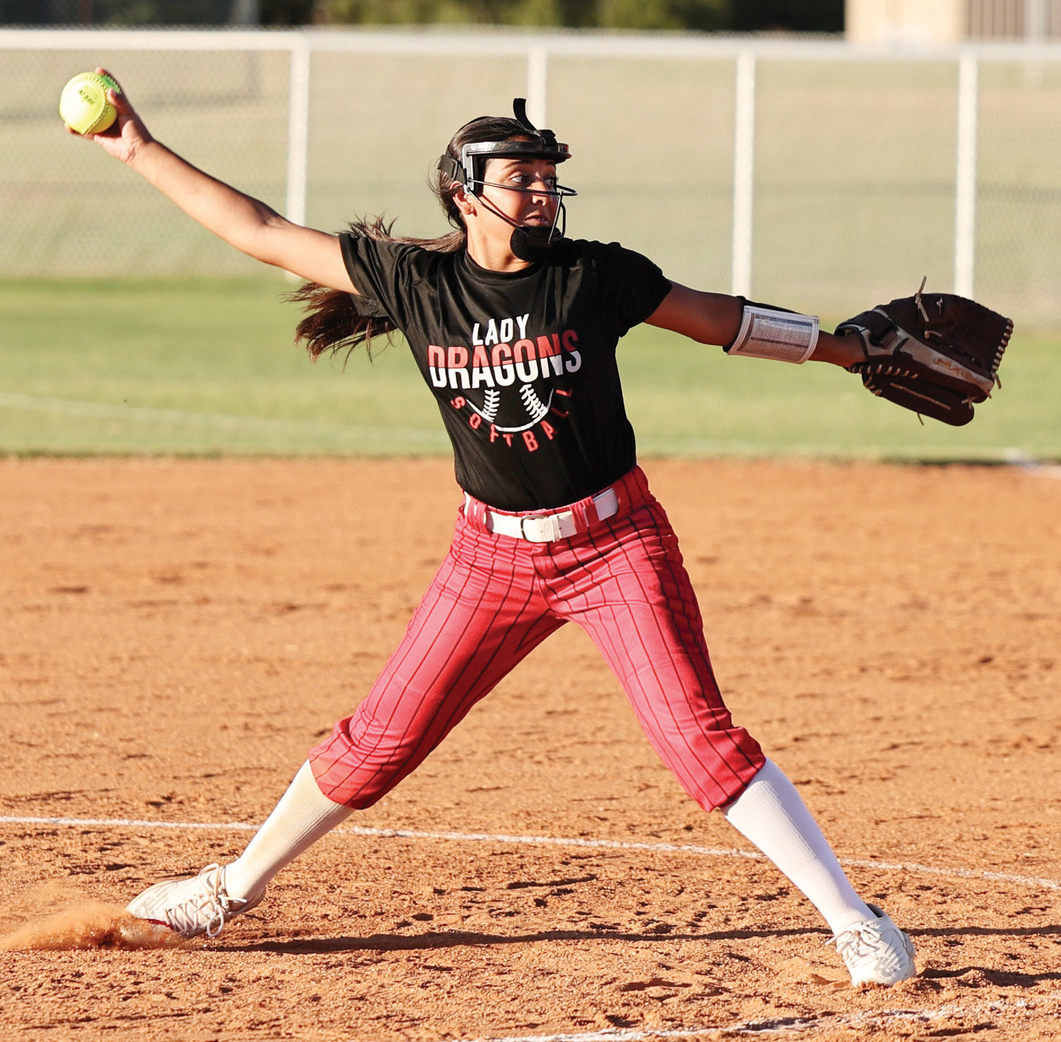 Purcell freshman Lili Del Toro throws a pitch to home plate during the Dragons’ 17-1 win over Meeker.