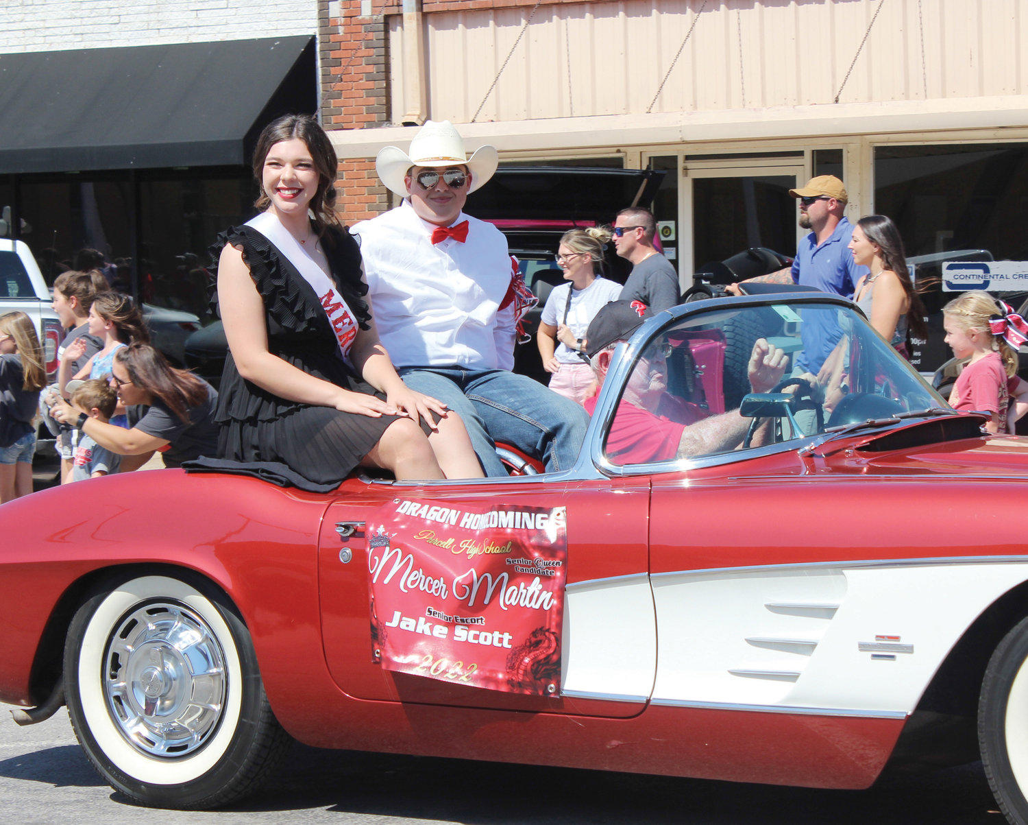 Mercer Martin and her escort, Jake Scott, were seated in a vintage Corvette.