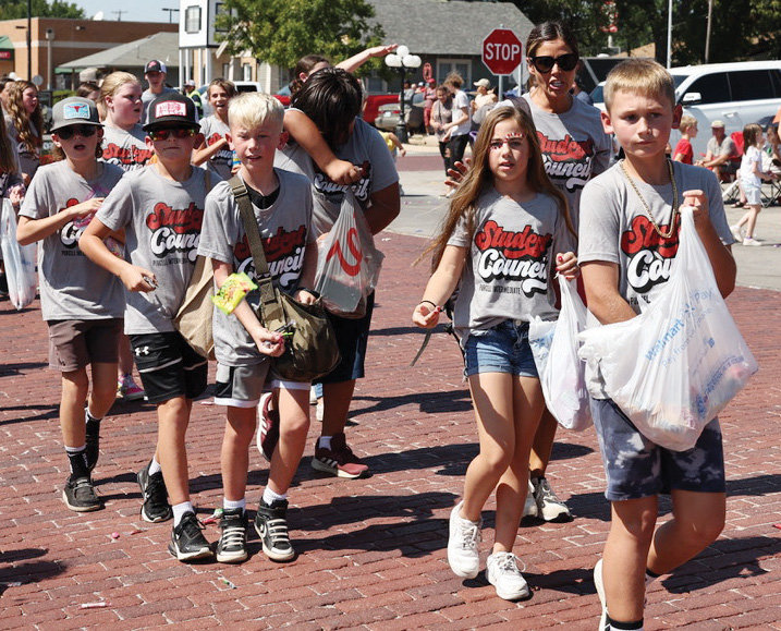 Intermediate school Student Council members passed out candy during the homecoming parade last Friday in Purcell.