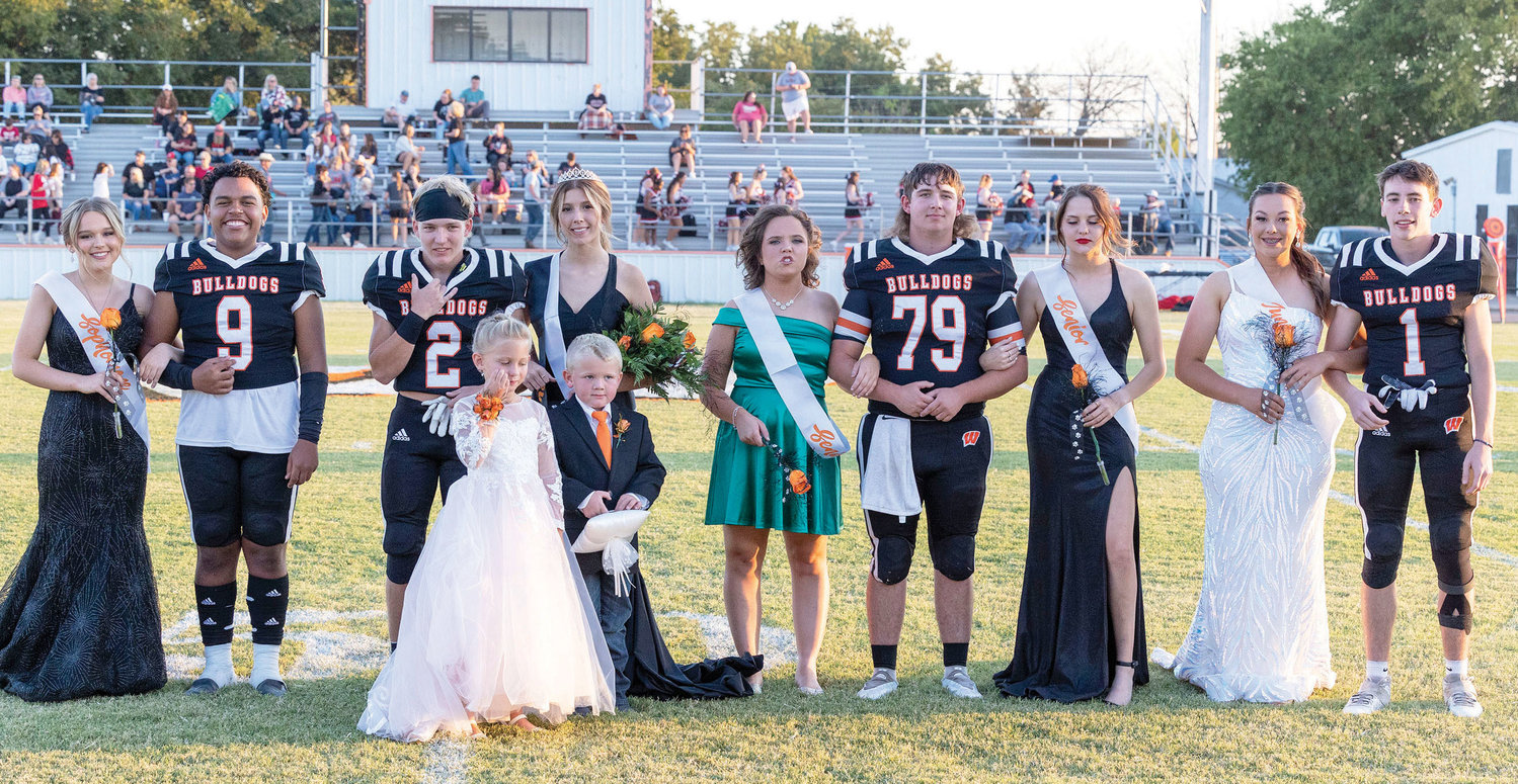 The Wayne Bulldogs held their Homecoming coronation last Friday before their game with Lindsay at D.S. Zack Powell Stadium. Pictured are, from left Morgan Cross, Taylan Bryant, King Rhett Kennedy, Queen Mikaela Hickman, Mallory Sharp, Lane Jones, Jayda Vaught, Faith Brazell and Kaleb Madden. The flower girls was Swayze Sharp and the crown bearer was Rhett Boles.