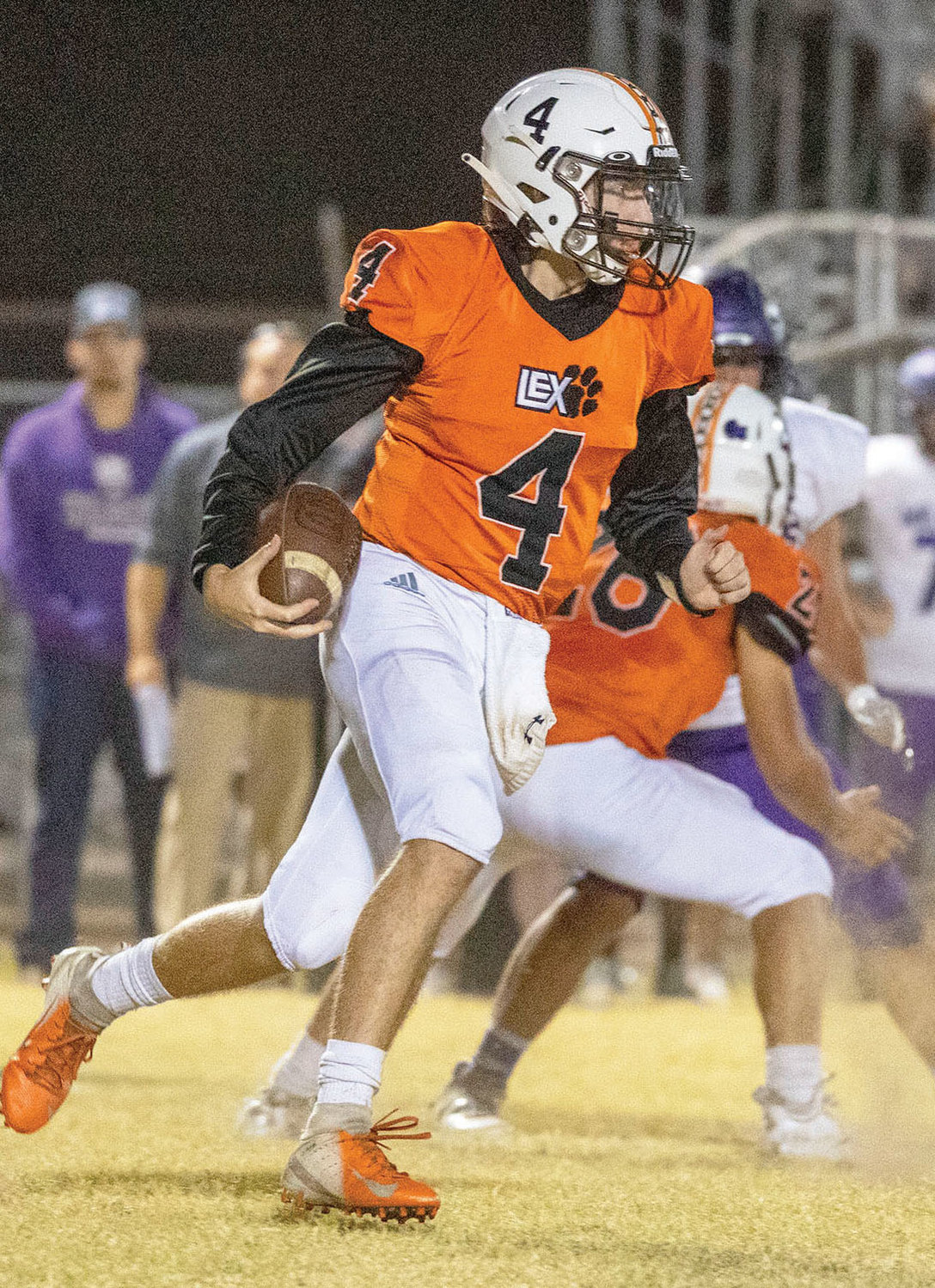 Lexington senior Tate Collier rushes the football against Coalgate Friday night. The Bulldogs were defeated 28-0. Collier had 142 yards passing on the night.
