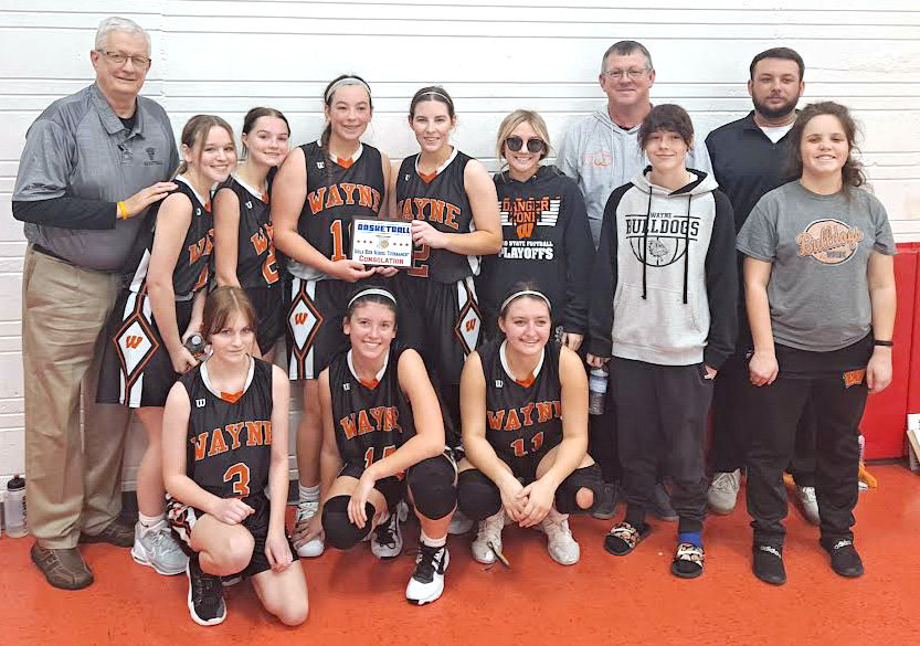 The Wayne Lady Bulldogs beat Geary 61-49 in the Consolation Championship of the Binger-Oney tournament to take home some hardware. Junior Jordynn Debaets led the Lady Bulldogs with 32 points in the win. Senior Kaylee Madden was named to the All-Tournament team. Pictured are, in front, from left, Ashlyn Kirkland, Jordynn Debaets and Brysten Shephard. In back, from left, are head coach Bill Burnett, Morgan Cross, Alyssa Hobson, Faith Brazell, Kaylee Madden, Madi Sharp, Karsen Adams and Mallory Sharp. In the back row are Chance Sharp and Jake Brazell.