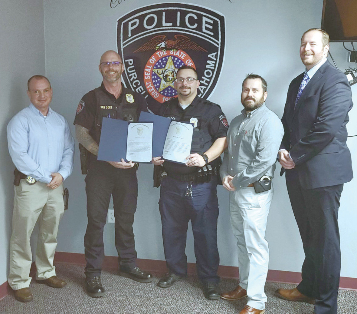 Purcell Police Sgt. Josh Van Oort and Officer Joshua Miller, second and third from the left, were honored by Chief Bobby Elmore, Assistant Chief James Bolling and Captain Jeff Hixon.