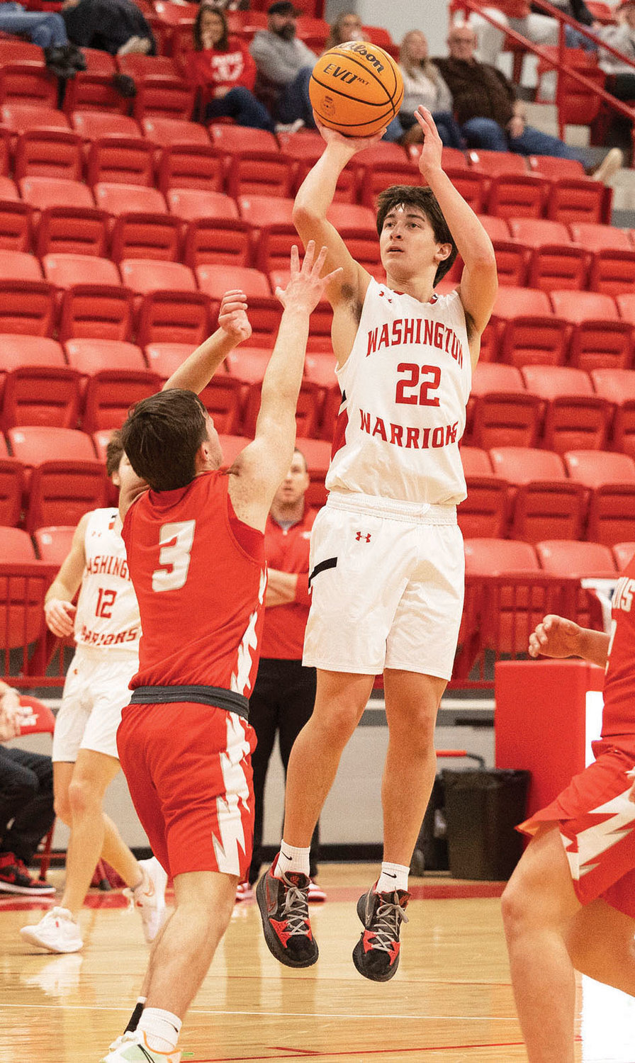 Washington sophomore Mason Adams pulls up for a jump shot during the Warriors’ 77-64 win over the Wolves. Adams scored a team-high 18 points.