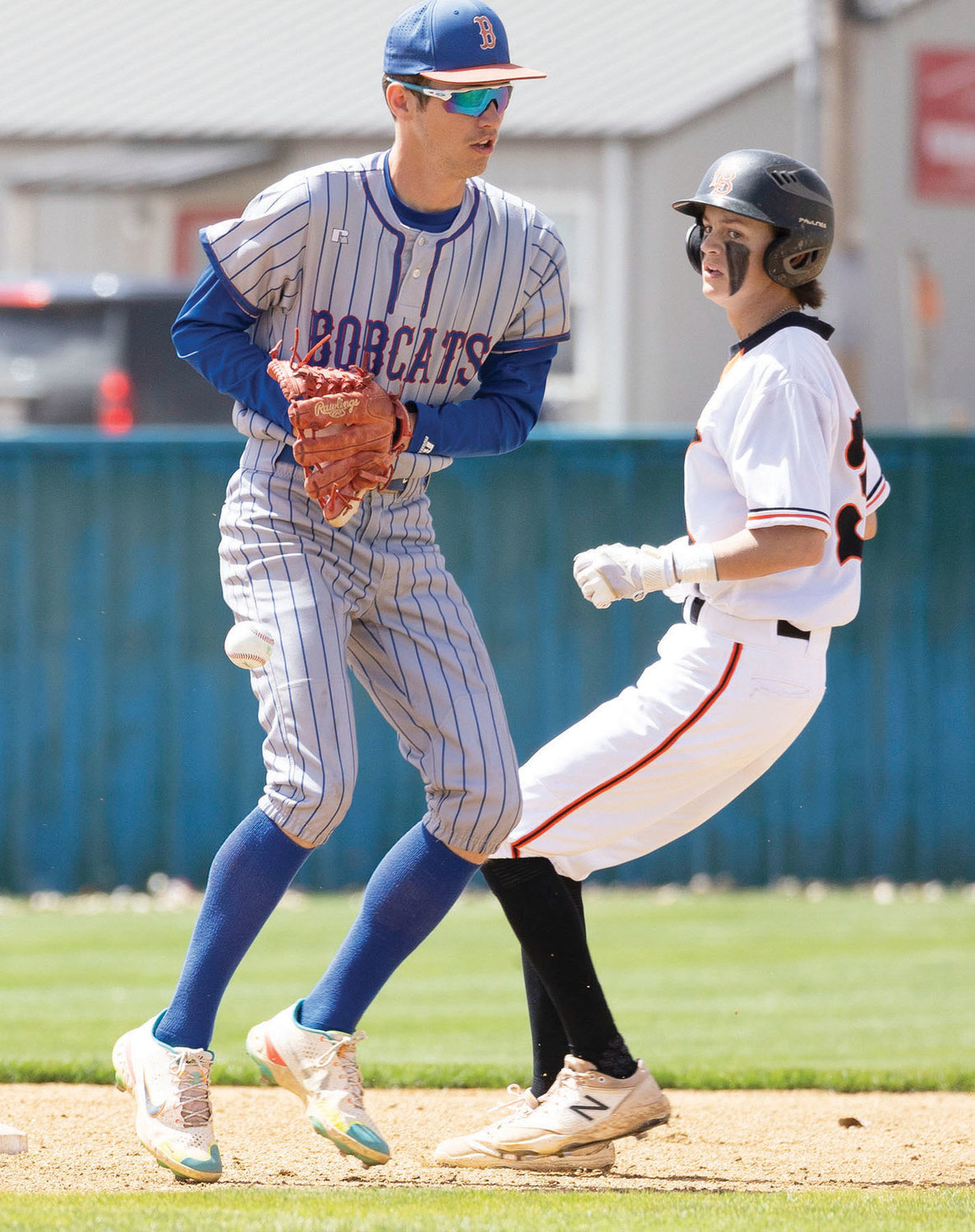 Lexington sophomore Dax Beason locates the ball while running the bases during the Bulldogs’ 8-4 win over Binger at the Dibble tournament. Beason was 2-2 with an RBI in the game.