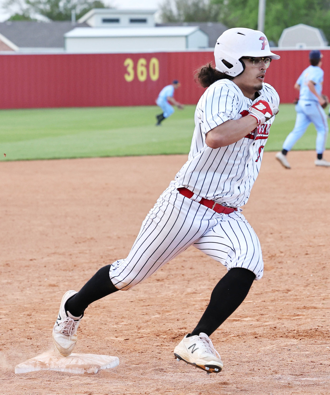 Purcell senior Logan Roberts scores a run in the fourth inning against Holdenville after Cole Smedley drove him in. The Dragons defeated the Wolverines 14-4.