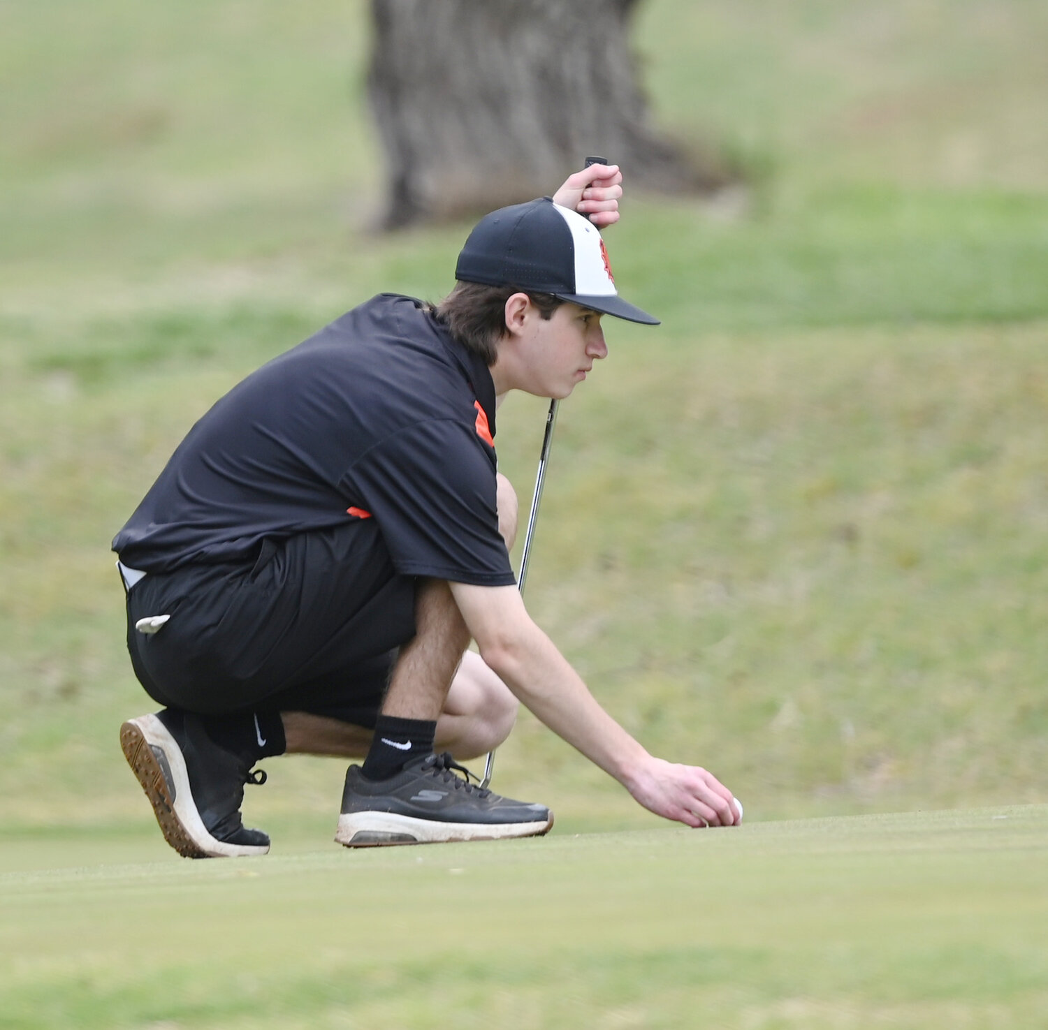Lexington sophomore Jhett Skaggs eyes his putt on hole No. 8 during the Regional golf tournament at Brent Bruehl Memorial Golf Course on Monday. Skaggs shot 94-91 for a two-round total of 185.