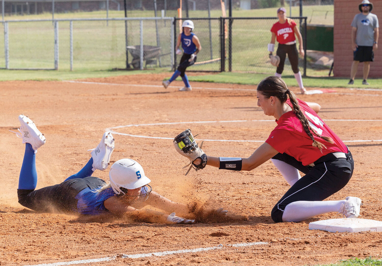 Purcell junior Ella Resendiz slaps a tag on a Stroud base runner Monday during a pre-season scrimmage. The Dragons are set to play Sulphur on Aug. 14. in their home opener.