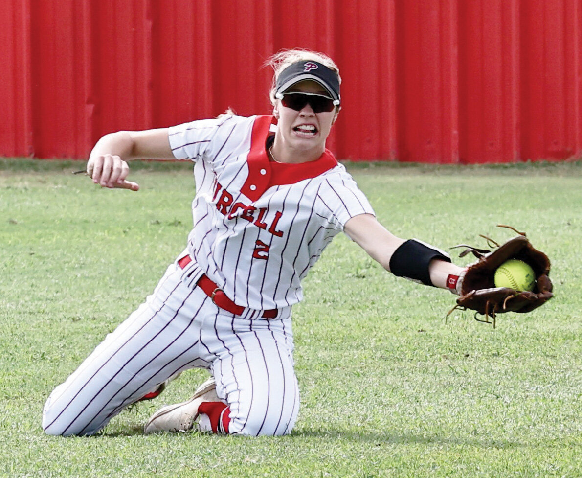 Purcell junior Hadleigh Harp makes a diving catch Monday during Purcell’s 10-0 win over Sulphur. The tough catch helped preserve teammate Ella Resendiz’s perfect game.