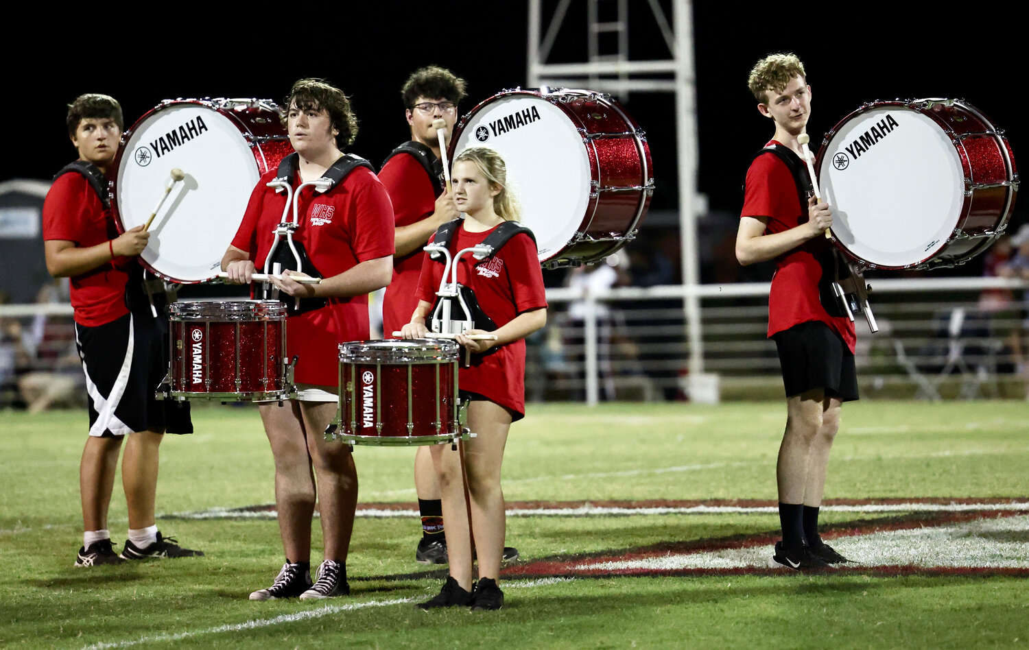 The Washington drumline readies for their performance during halftime of the Warrior football game against Jones Friday night.