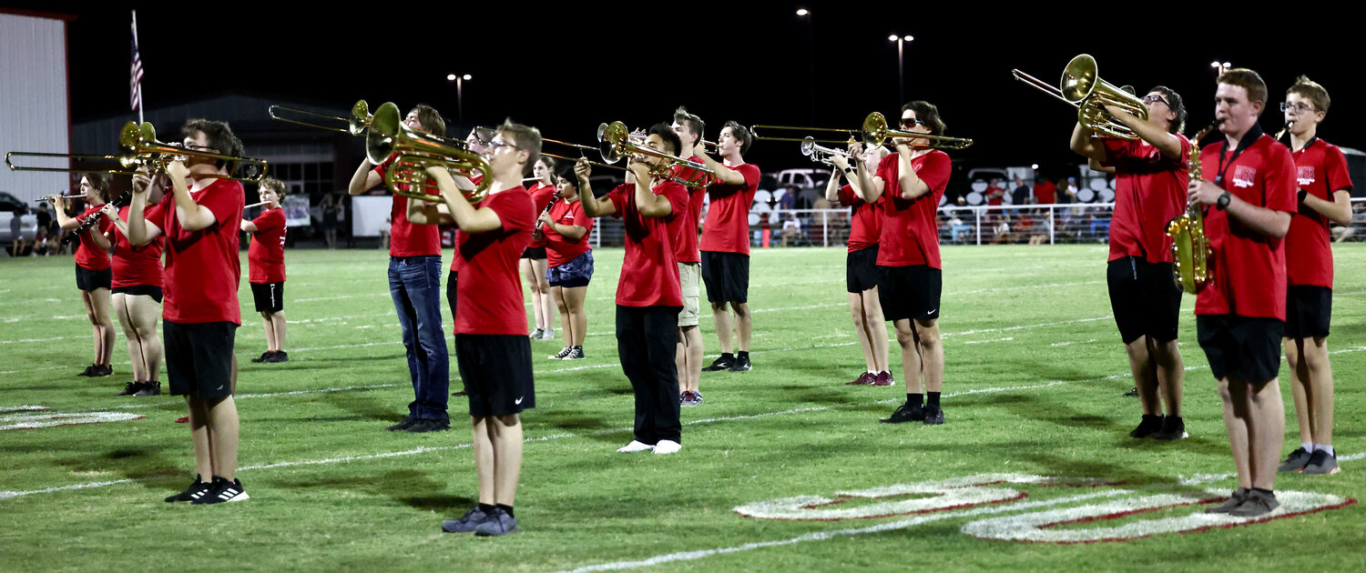 The Washington band performs at halftime of the Warriors’ football game against Jones High School on Friday night.