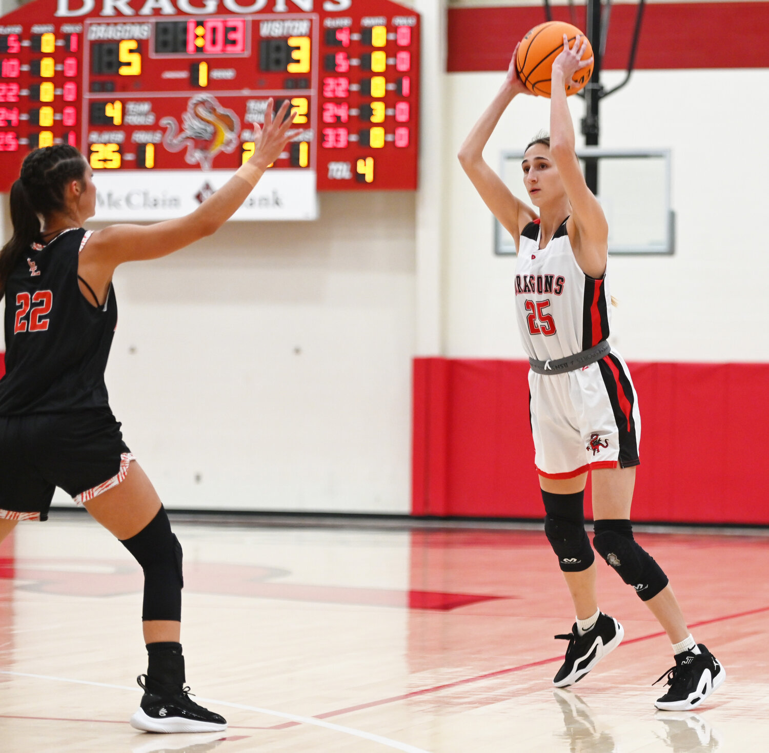 Purcell senior Alyssa Thompson feeds the ball into the post during the Dragons’ 50-29 win over the Leopards. Thompson scored three points in the game.