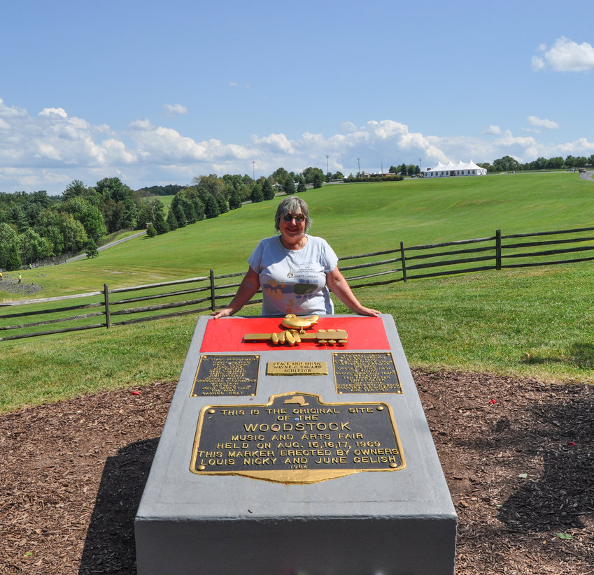 Visiting-friend Kelli with the Woodstock memorial. 