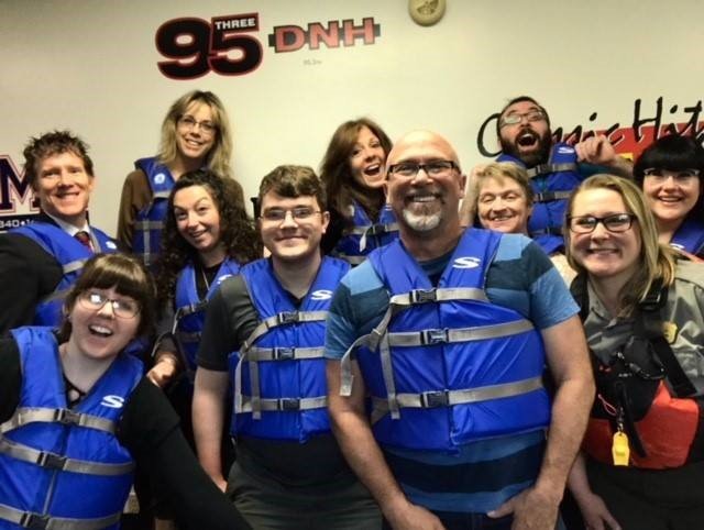 Bold Gold Media staff and Park Ranger Susie Kaspar enthusiastically wear their life jackets to work.