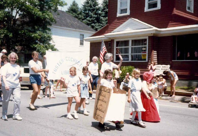 This snapshot of the 1988 Narrowsburg July 4 parade features the library movers and shakers, Beth, in white shirt, left, Jean Kerrigan, adult walking to the right of the library banner, and Grace Johansen, center, waving her hand. Beth was adept at finding like-minded people and making their dreams and visions come true. It was a gift she possessed.