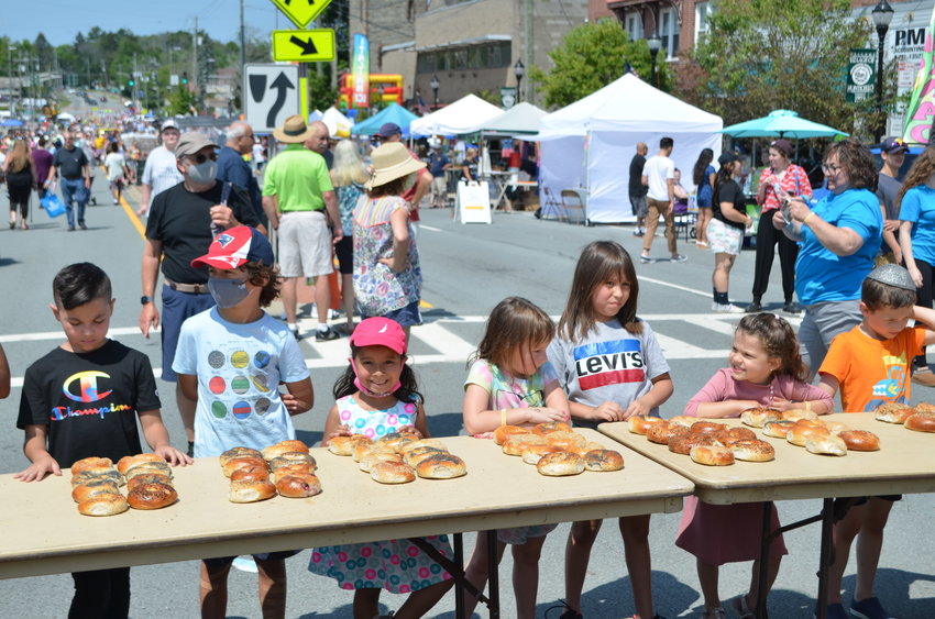 Children lining up to participate in the bagel-stacking competition.