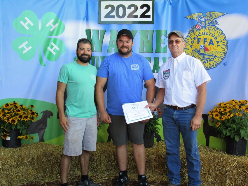The Honesdale Jaycees donated $600 to the Nebzydoski-White Memorial Scholarship Fund. Pictured are Jaycees president Chase Holl, left, Corey Rutledge and livestock sale board chairman Ron Scull.
