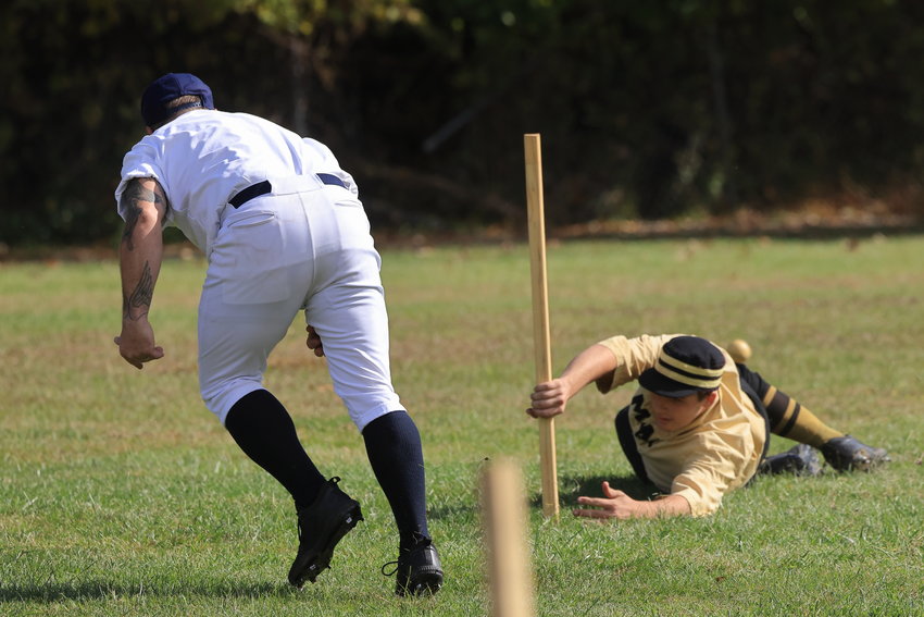 Around 1825, the field was laid out in more of a circle than a diamond, and the “bases” were actually sticks stuck in the field. Pictured is a Delhi Polecat, in white, attempting to “soak” the Mountain Athletic Club base runner, who is safe by virtue of his hold on the stake (base).