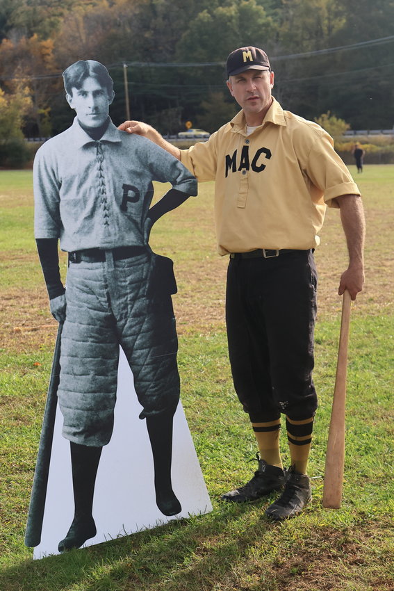 Colin Miller of the Mountain Athletic Club and spokesman for the day, poses with a cutout likeness of Zane Grey dressed in his baseball attire from Grey’s collegiate career at the University of Pennsylvania in the mid-1890s.