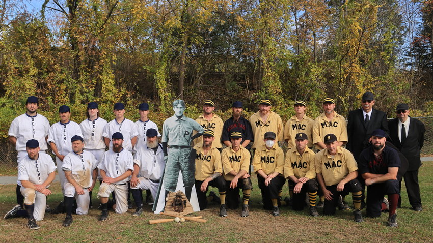 A group photo of Polecats Vintage Base Ball Club on the left, Zane Grey’s likeness in his University of Pennsylvania baseball uniform of the mid-1890s in the center, the Mountain Athletic Club on the right, and the umpires for the day on the far right.