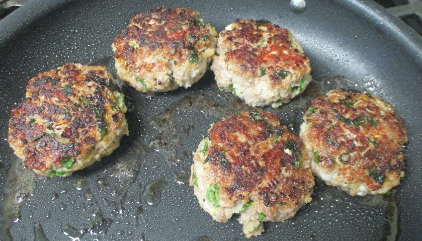 Pan-frying the Asian-style burgers.