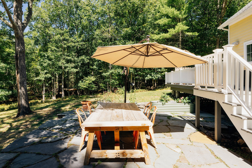 Off the deck is a bluestone patio with plenty of seating and beautiful views.