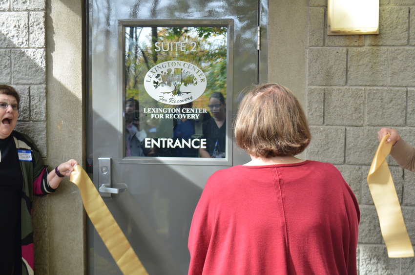 Adrienne Marcus, executive director for the Lexington Center for Recovery, cutting the ribbon for the center's Sullivan County location on October 28.