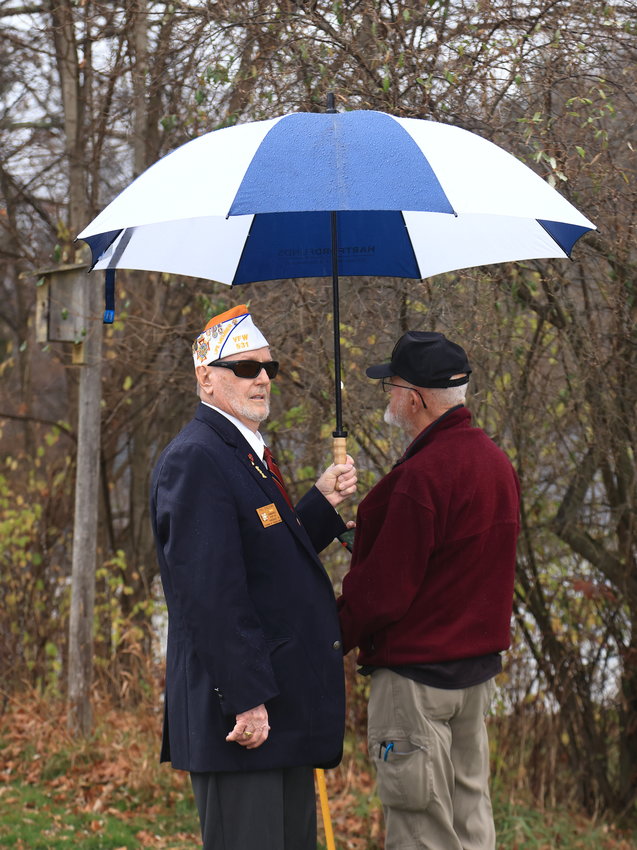 Phil Sheehan, VFW Commander of Post 531 in Honesdale, saw an unidentified veteran standing out in the rain waiting for the gun salute and taps. He offered his umbrella to shield the veteran against the rain.