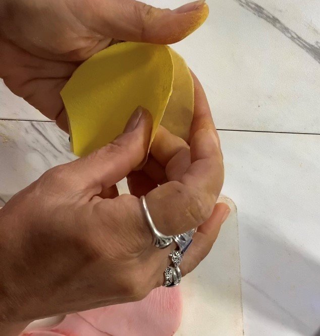 Spray the inside of two petals with Paper Potion, then stick them together. Trim if necessary, then repeat until all petals have been created...