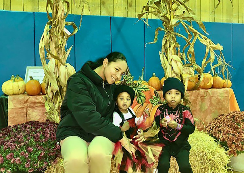 A family poses for a photo at a recent harvest festival, hosted by EPIC.