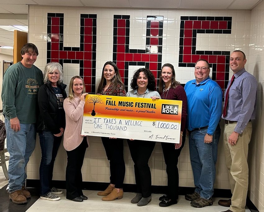 The Fall Music Festival recently donated $1,000 to the program It Takes a Village. Pictured are Jamie Rutherford, left; Suzie Frisch; Amy Gries; Erica Murray; Christina Siepiela; Paige Pinto; Joe Adams; and Brandon Diefenbach...