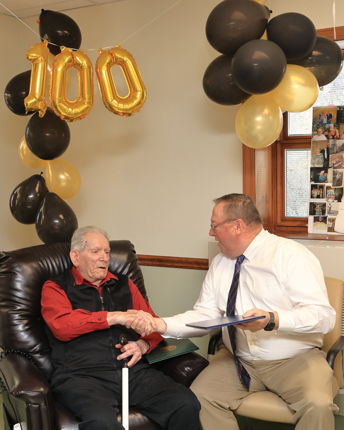 State Rep. Joe Adams congratulates Raymond “Ray” Naholnik as he presents him with a PA Senate Citation in recognition of his 100th birthday...